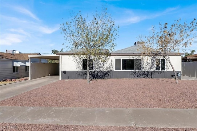 view of front of property featuring a carport