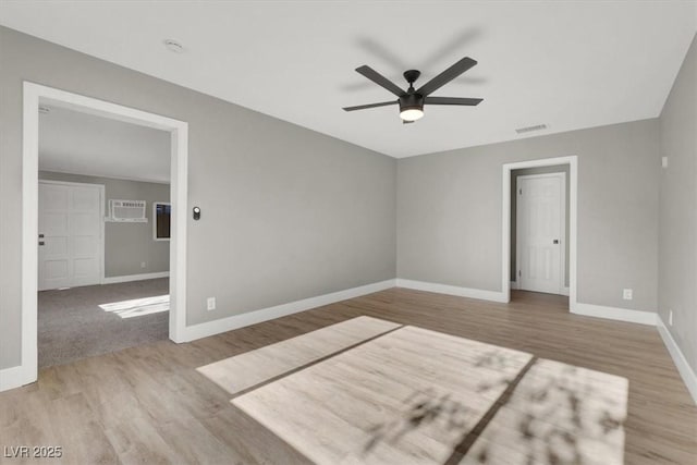 empty room with light hardwood / wood-style flooring and ceiling fan