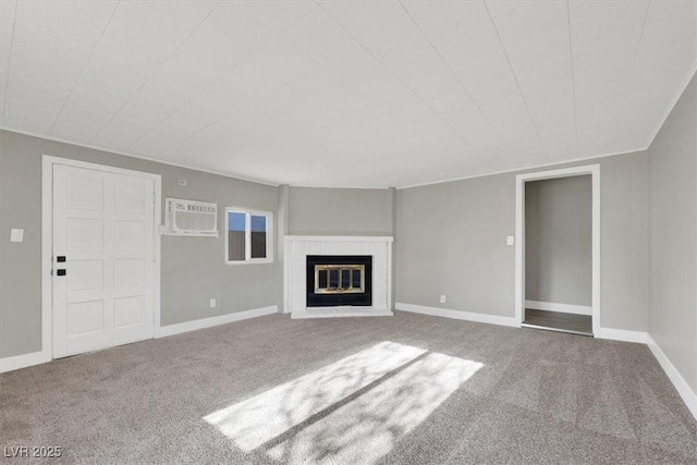 unfurnished living room featuring carpet flooring and a wall mounted AC