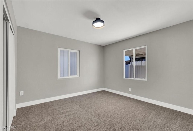 unfurnished room with carpet floors