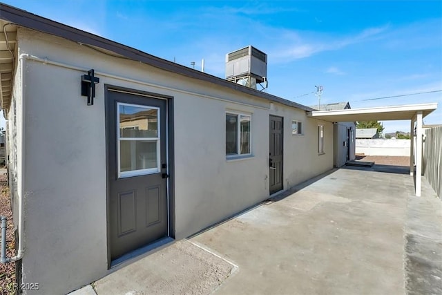 exterior space with cooling unit and a patio area