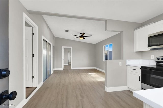 kitchen featuring ceiling fan, stainless steel appliances, light hardwood / wood-style floors, and white cabinets