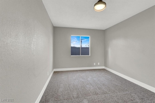 spare room featuring carpet floors