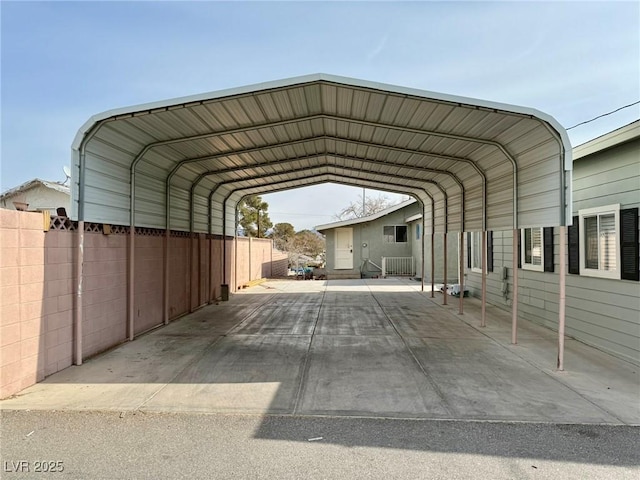 view of parking / parking lot featuring a carport