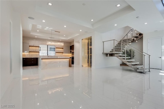 interior space with a tray ceiling