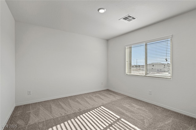 unfurnished room featuring carpet flooring