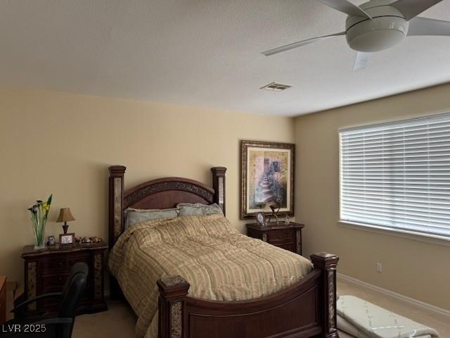 carpeted bedroom featuring ceiling fan