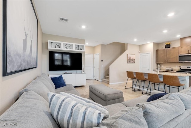 living room featuring light tile patterned floors