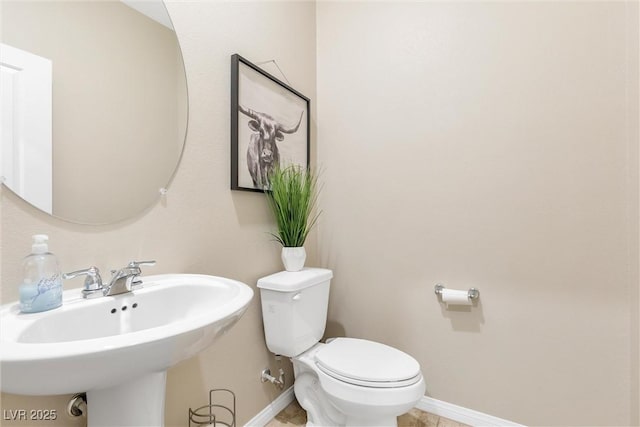 bathroom featuring sink and toilet