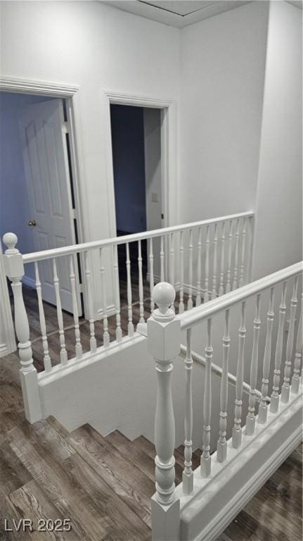 stairway with wood finished floors