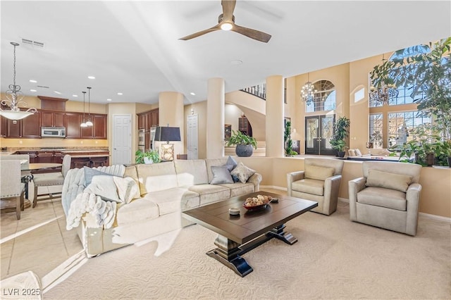 tiled living room featuring ceiling fan