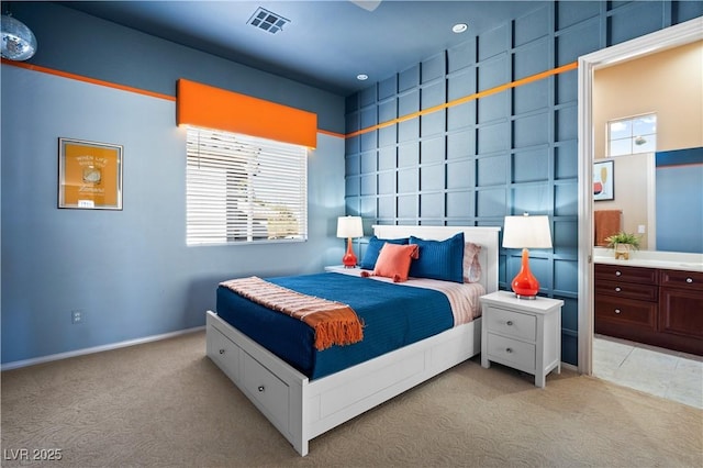 bedroom featuring light carpet and visible vents