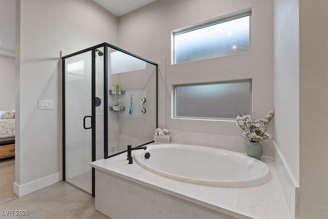 bathroom with tile patterned floors and plus walk in shower