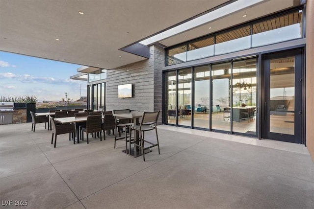 view of patio featuring a grill and an outdoor kitchen