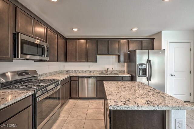 kitchen featuring sink, dark brown cabinets, and appliances with stainless steel finishes