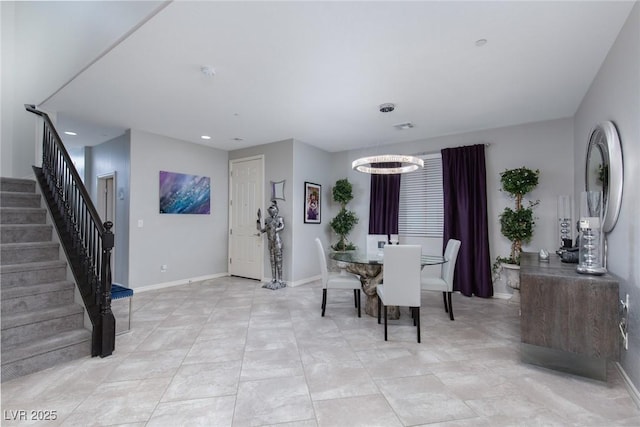 dining area featuring recessed lighting, stairway, baseboards, and an inviting chandelier