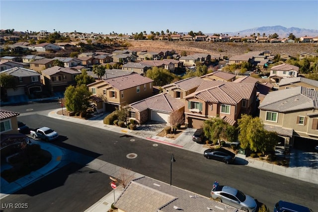 birds eye view of property with a residential view and a mountain view