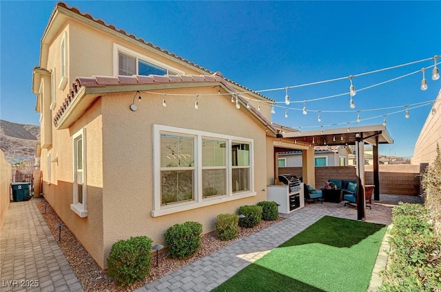 rear view of house featuring a patio