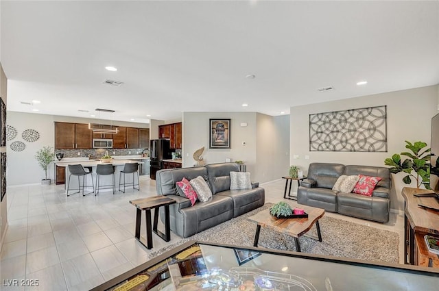 living room with light tile patterned flooring