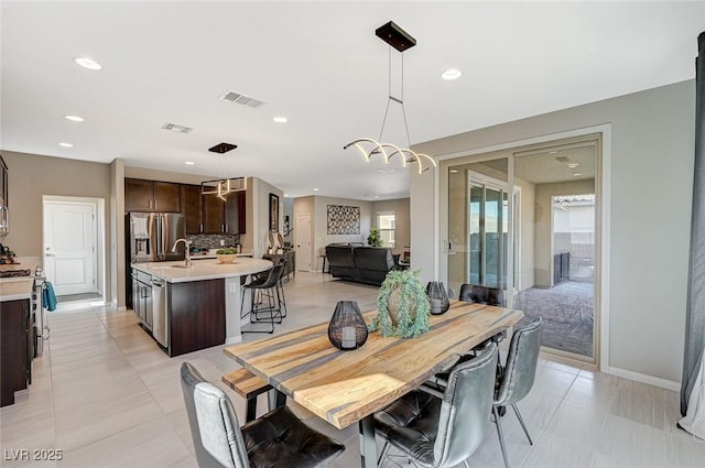 dining space featuring sink