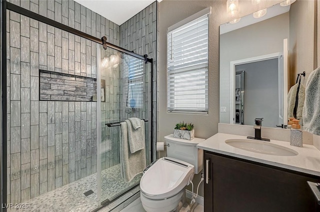 bathroom featuring vanity, toilet, and walk in shower