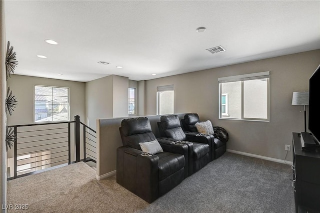 home theater room featuring dark colored carpet