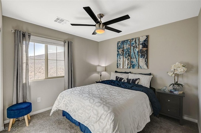 bedroom featuring ceiling fan and dark carpet