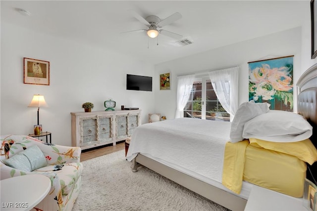 bedroom featuring wood-type flooring and ceiling fan