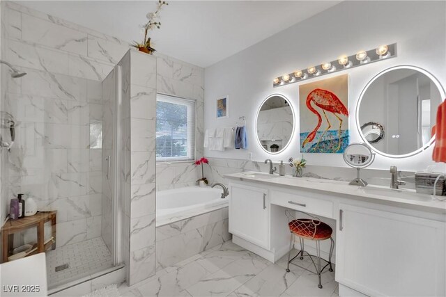 bathroom with vanity and separate shower and tub