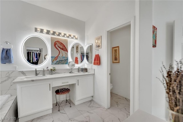 bathroom with vanity and toilet