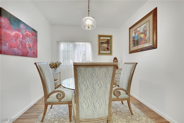 dining space featuring light hardwood / wood-style flooring