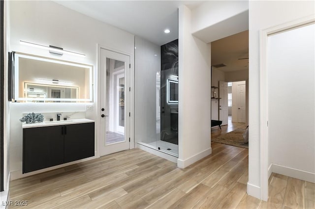 bathroom with vanity and hardwood / wood-style floors