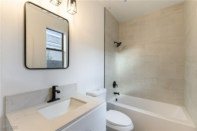 full bathroom with vanity, toilet, and tiled shower / bath combo