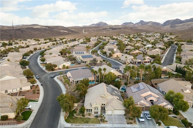 birds eye view of property featuring a mountain view