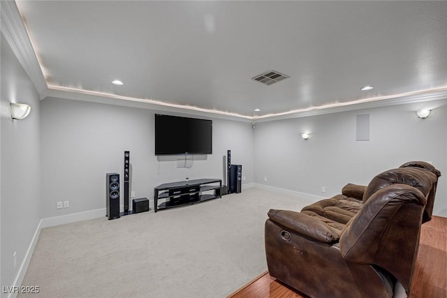 cinema room featuring light carpet