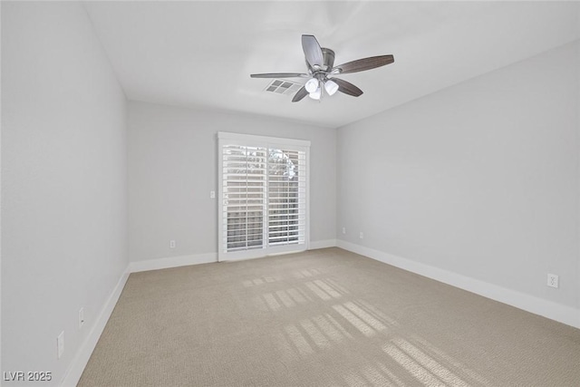 empty room featuring ceiling fan and carpet floors