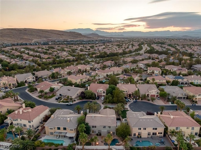 aerial view at dusk with a mountain view