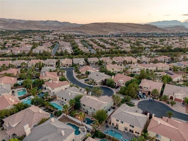 aerial view at dusk with a mountain view