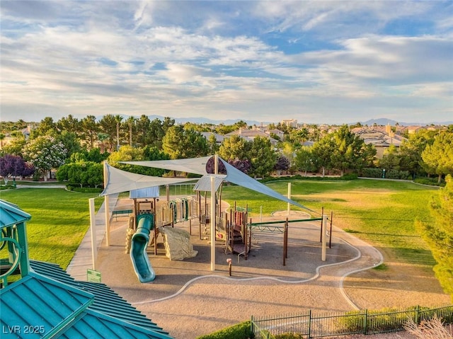 view of playground with a lawn