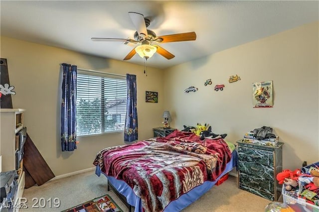 bedroom with ceiling fan and carpet