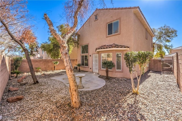 rear view of house with a patio