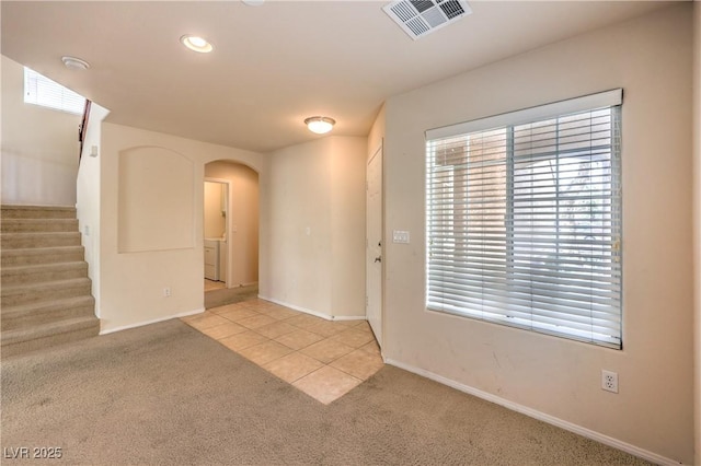 view of carpeted entrance foyer