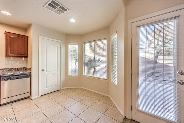 interior space featuring light tile patterned floors