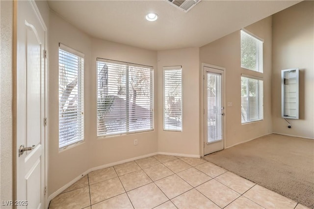 entryway with light carpet