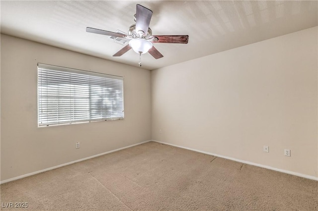 unfurnished room with light carpet and ceiling fan