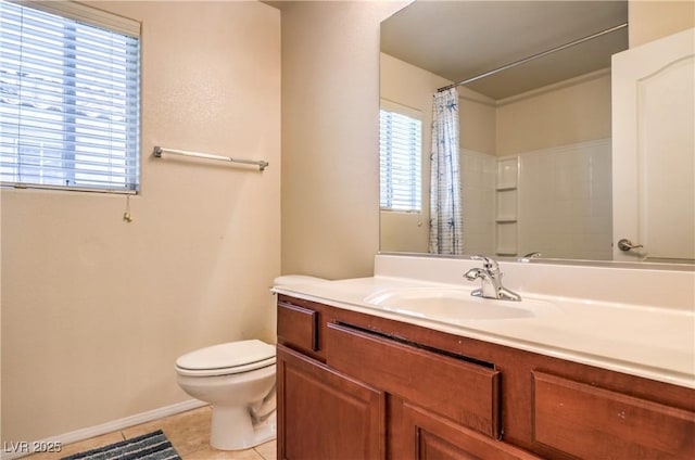 bathroom featuring a wealth of natural light, tile patterned floors, a shower with shower curtain, and toilet