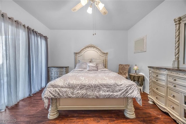 bedroom with dark hardwood / wood-style floors and ceiling fan