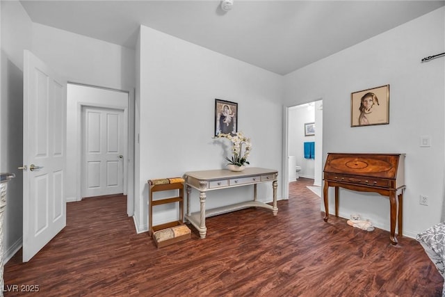 hallway with dark hardwood / wood-style flooring