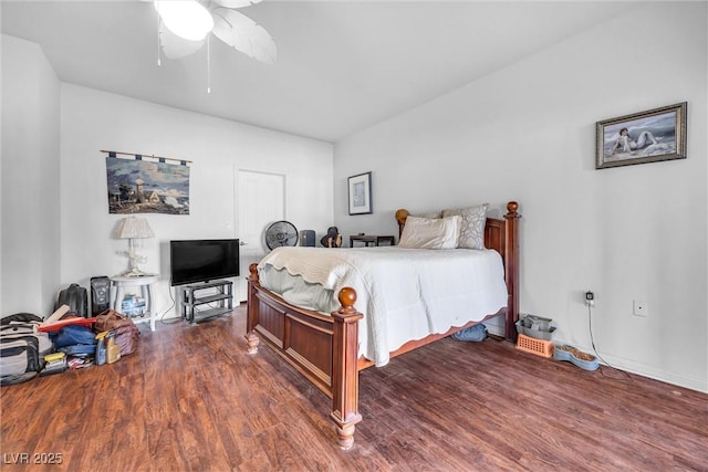 bedroom with dark wood-type flooring and ceiling fan