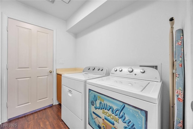 washroom with separate washer and dryer and dark wood-type flooring